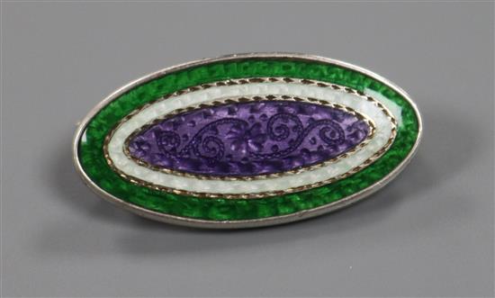 An early 20th century sterling silver mounted three colour enamel oval Suffragette brooch, 30mm.